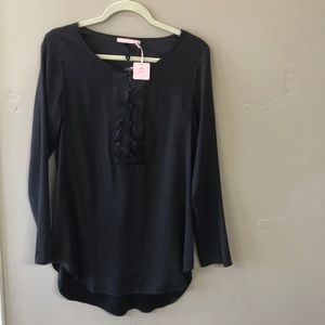 NWT Calypso tunic top black and very sleek.